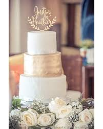 This plastic cake decoration is shaped like cursive letters that this resin cake topper has the bride pulling the groom's leg as he tries to crawl away. Shopping Special For Personalized Wedding Cake Topper Rustic Wedding Cake Topper Wooden Cake Topper Names Cake Topper