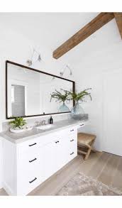 The metal white of the cabinets and the dark gray glossy countertops as well as the matching backsplash really make this modern kitchen stylishly contemporary. Calm Master Bathroom A Coastal Design By Pure Salt Interiors In 2021 Pure Salt Interiors Grey Countertops Master Bathroom Design