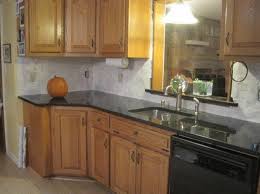 From a distance, uba tuba granite looks deep black in color, but you can see that it is not a solid uniform color. Honey Oak Ubatuba Which Backsplash