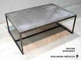 A 2 solid wood top, 2 tubular base, no cross members, and no other structural. Concrete Coffee Table