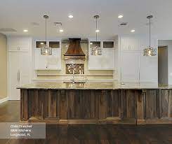 Fixtures, sink, flooring, even the kitchen cabinets. White Cabinets With A Walnut Kitchen Island Masterbrand