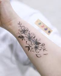 A simple cherry blossom line drawing or a colored cherry blossom tattoo with falling petals are good ideas for a minimal sakura tree tattoo design. 27 Charming Cherry Blossom Tattoo Examples