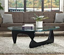 Designed in 1944, the noguchi coffee table's organic base is carved from a choice of black ash or walnut supporting an elegantly shaped glass top. Isamu Noguchi Black Finish Coffee Table Design Plus Gallery
