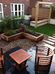 This Contemporary Garden Design Features Black Limestone Paving A Chunky Oak Frame Which Will Support A Great Contemporary Garden Modern Garden Garden Design