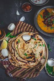 Serve the chicken and sauce ladled into the center of the roti breads, then fold both sides over the filling. How To Make Tandoori Roti On Tawa Gastronomic Bong