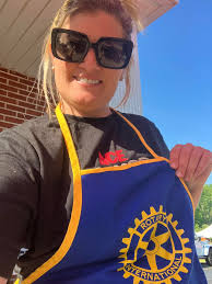 Ashley Howell at Front Desk of Aurora Inn Hotel and Event Center