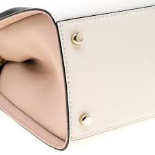 Much like the revolutionary characteristics of kate spade, the brand never settles its advertising content to be just a shot of the product or a celebrity toting a bag on the shoulder. Kate Spade Tri Color Leather Mini Candace Top Handle Bag Kate Spade Tlc
