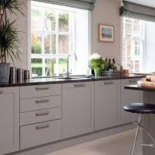 Black And Grey Kitchen Cupboards Kitchen With Pale Wood Floor Soft Grey Units Black Granite Worktops And Black Bar Stools Teethwhit Teal Kitchen Decor Country Kitchen Grey Kitchen Cupboards