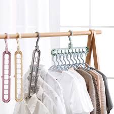 Garment racks are simple frames made out of plastic or metal, like the racks that stores use to hang clothes. Sale Multifunction Clothes Hangers Baby Clothes Drying Racks Storage Rack Hang Clothes Coat Hangers Organizer Plastic 9 5holes Hangers Racks Aliexpress