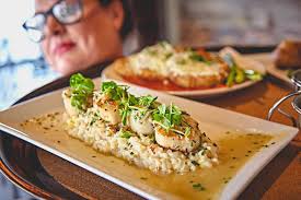 Our Pan-Seared Scallops are epitome of luxury with a Dungeness & Blue crab  corn risotto. Make a reservation: https://bit.ly/2zAohFB