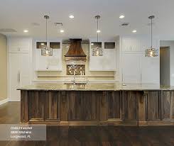 white cabinets with a walnut kitchen