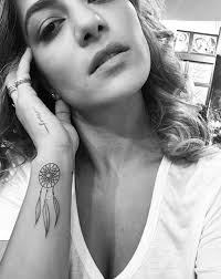 Dream catcher with bold flowers: 90 Inspirational Dream Catcher Tattoo Designs Done Right