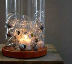 14 Brilliant Ways To Repurpose Lightbulbs Recycled Light Bulbs Light Bulb Candle Diy Lamp
