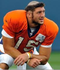 About tim tebow upcoming events video & photography. Tim Tebow S Statue Of Liberty Haircut Turns Heads At Broncos Practice
