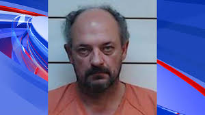 Man charged in death of wife, whose skull was found