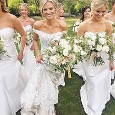 All White We Adore This Beautiful Bride Elisabethandbutter And Her Bright White Bridesm Romantic Bridesmaid Dresses White Bridesmaid White Bridesmaid Dresses