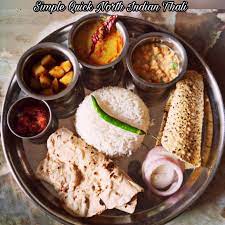 Simple Quick North Indian Thali Items Aloo Jeera Dal Tadka Boondi Raita Rajasthani Chilli Pickle Roti Rice Salad And Papad Veg Thali Asian Cooking Food