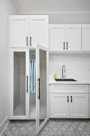 White Laundry Room Cabinets With Black Grille Doors Transitional Laundry Room