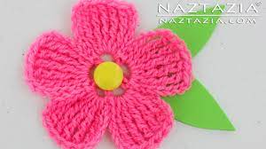 • now carry on the chain stitch 5 times and latch it on to the middle of your flower. How To Crochet A Flower For Beginners Step By Step How To Wiki 89