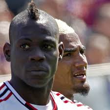 In this April 7, 2013 file photo, AC Milan&#39;s Kevin Prince Boateng, right, and his teammate Mario Balotelli, are seen during a Serie A soccer match between ... - Italy-and-AC-Milan-star-Mario-Balotell