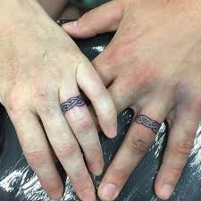 78 Wedding Ring Tattoos Done To Symbolize Your Love Ring Finger Tattoos Wedding Band Tattoo Ring Tattoo Designs