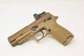 It comes with a red dot sight mounted on the slide. Sig Sauer P320 M17 Red Dot Adapter Mount By Outerimpact