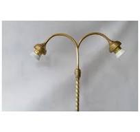 A French brass and glass two branched table lamp, 1910 to 1925.