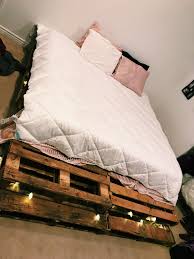Find A Local Add On Craigslist That Offers Free Pallets Grab A Hand Sander From Home Depot Then Place On Top Of One Another Weave Ligh Diy Pallet Bed Home Decor