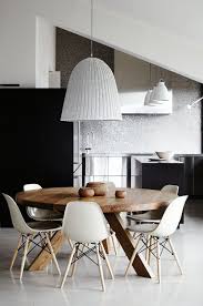 Black wasowsky dining chair with beechwood legs. A Stylish Apartment In Melbourne Australia Round Dining Table House Interior Interior