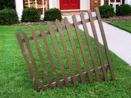 Snap the ends of the top and bottom rails into the appropriate holes on the fence posts. Halloween Decoration Build A Crooked Cemetery Fence How Tos Diy