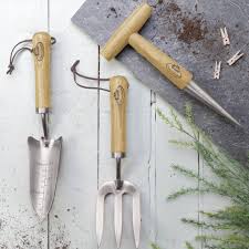 What kind of metal is a garden trowel made of? Garden Tools In Wood And Stainless Steel By The Little Boys Room Notonthehighstreet Com
