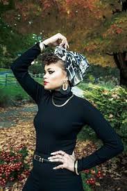 Her parents are both black. Andra Day