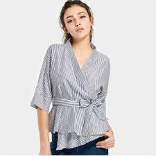 Buttoned twist waist linen blouse black black designed in los angeles. Agar Tidak Salah Pilih Kenali 25 Model Blus Wanita Untuk Tampil Lebih Stylish