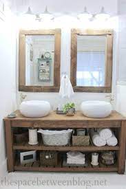 You will want to measure the length and width of the mirror and then cut the wood a little shorter so that the mirror can sit behind it without showing the edges. Diy Reclaimed Wood Frames The Space Between