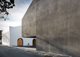 Rutgers university is only blocks away, as is the heldrich center and the theater district featuring cross roads theater, the george street play house, . Arts Centre Pairs White Rendered Concrete With Volcanic Stone