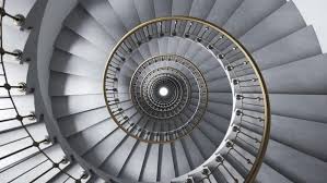 Bright glamour spiral staircase endless loop. Camera moving down ...