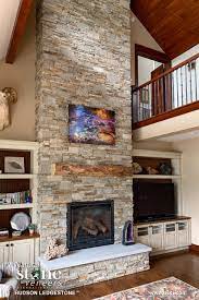 Natural stone absorbs, stores and radiates heat, so it can actually improve the efficiency of your and when it comes to fireplace design, natural stone is simply the most elegant, durable, and efficient. Hudson Ledgestone Stone Veneer Fireplace Stone Electric Fireplace Fireplace