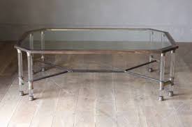 This lovely table is topped with a thick tempered glass top and with a lower level shelf which allows for ample display space. Antique A Large Brass And Lucite Coffee Table Antiques Co Uk