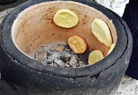 Cuisson terre cuite four traditionnel. Pain Tabouna Boulangerie