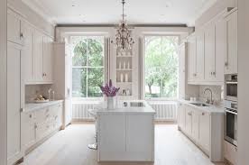 White kitchen cabinets with ornament can give your kitchen a classic and elegant look. Home Architec Ideas White Kitchen Ideas Images