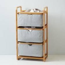 Made from luxe felt, you'd never know this basket was made. Bamboo Trim Gray Triple Shelving Hamper