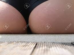 Sexy Female Buttocks Cute Ass In Wet Black Bikini With Water Drops Sit  Outdoors On Sunny Summer Day Stock Photo, Picture and Royalty Free Image.  Image 67314901.