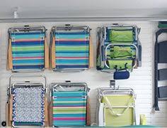 Garage Storage Solutions Slat Wall With Beach Chair Storage Hooks Installed By Neat Storage D Garage Storage Solutions Slat Wall Storage Rv Storage Solutions