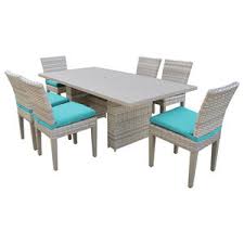 The rectangle dining table features a trestle style base, perfecting the rustic, farmhouse style. Fairmont 60 Outdoor Patio Dining Table With 6 Armless Chairs Tropical Outdoor Dining Sets By Design Furnishings Houzz