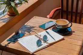 A glass coffee table makes for an elegant, subtle addition to the room, while a coffee table with storage is perfect for creating space for a striking centerpiece. A Copy Book Sunglasses And A Cup Of Coffee On The Table Write My Essays