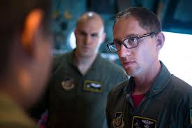 Capt. Mark Nexon, 36th Airlift Squadron pilot, listens