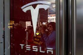 Anti-DOGE protests at Tesla stores target Elon Musk's bottom line