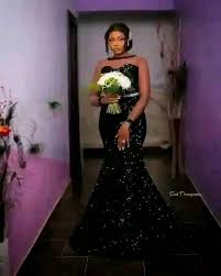 White wedding gown signify virginity, what about the black suit?