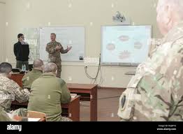 Capt. Kurt Jarvis, a member of Headquarters and Headquarters Company, 1st  Battalion, 179th Infantry Regiment, 45th Infantry Brigade Combat Team and a  resident of Edmond, Oklahoma, teaches a class about operational structure