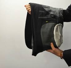 How To Pack A Suit 4 Simple Steps To Fold A Suit Properly Black Lapel Fold Suit Jacket Suits Suit Jacket
